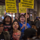 Anti-Donald Trump protesters rally outside the InterContinental Los Angeles Downtown hotel, where he spent the night during his first visit to California since taking office, on March 13, 2018, in Los Angeles.